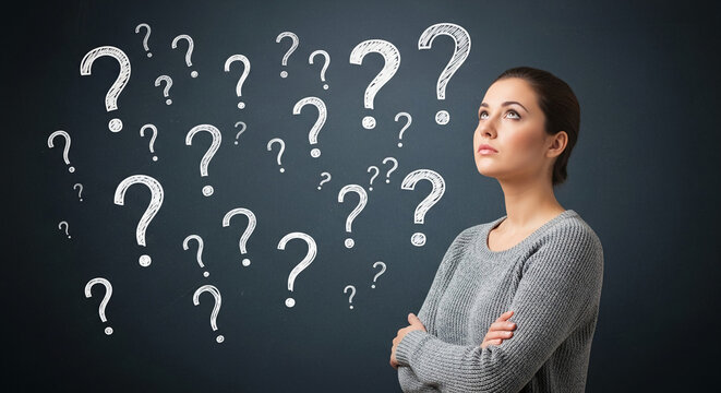Woman in gray sweater contemplates numerous question marks, symbolizing uncertainty, decision-making, or problem-solving