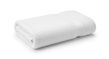 Fototapeta premium Luxurious plush white bath towel expertly folded for spa, hotel, or home comfort and cleanliness