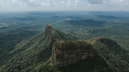 Drone aerial photography revealing stunning natural vistas of rugged mountains, lush greenery, and varied terrain.