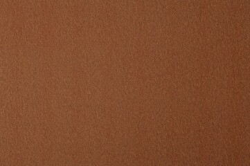Fototapeta premium Brown textile surface as a backdrop. Abstract design, blank layout. Overhead perspective. background,pattern,abstract,design,paper,fashion,nature,vintage,retro,paint