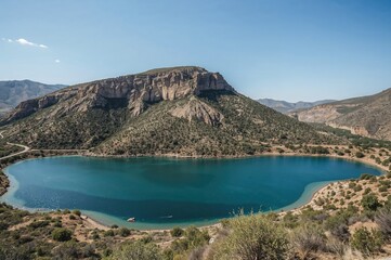 Azure water and sculpted cliffs of an old deserted quarry