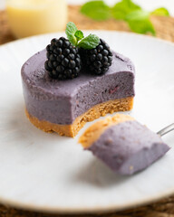 Blackberry mousse tart with a biscuit base. Traditional French recipe.