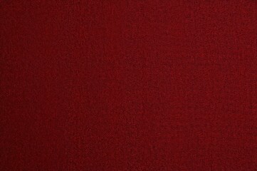 A red backdrop featuring a delicate screen texture.