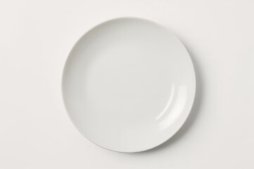 Top view of an empty circular ceramic dish on a white background with shadow and clipping path
