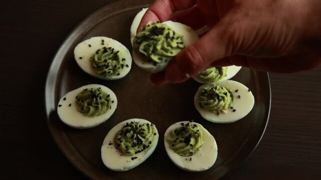 rotten-style green devil eggs served as spooky Halloween party finger food