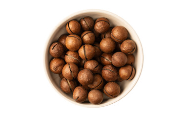 Macadamia nuts in a shell isolated on a white background.