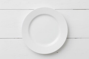 Empty dish placed on a white wooden surface. Overhead perspective.