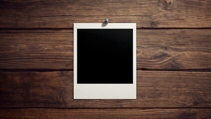 Blank Instant Photo Frame on Rustic Wood