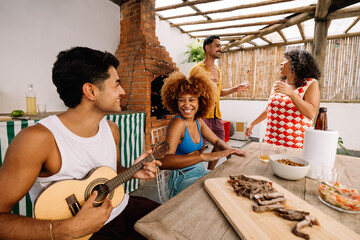 Group of friends enjoying samba music and churrasco in Rio de Janeiro