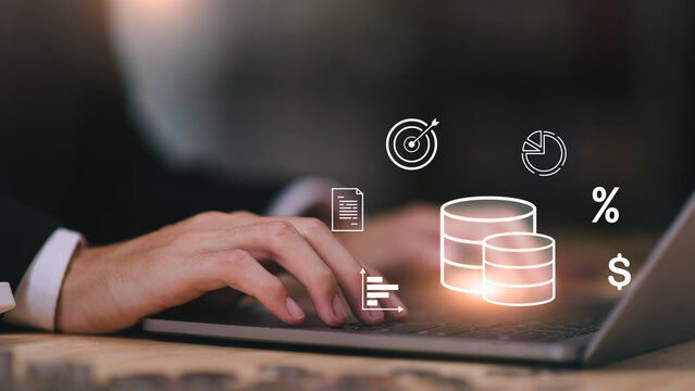 Businessman using laptop with finance icons, showing digital money management, investment strategy, profit analysis, percentage rates, and financial goal planning in a modern business environment.