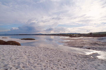 Sunset over The brackish lagoons of Saline, a few kilometers south of Stintino, behind the white beach of the same name. Stintino, Sassari, Sardinia, Italy