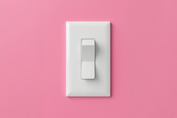 A white light switch captured up close against a pink backdrop