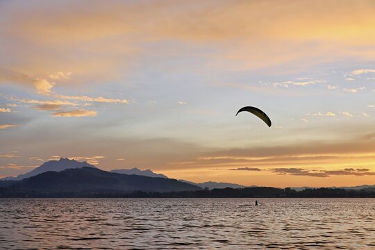 Kitesurfer on Lake Zug at sunset, Pilatus in the background, Zug, Canton Zug, Switzerland