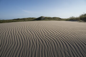 Dunes, wave pattern in the sand, blue sky, Hvide Sande, North Sea, Denmark
