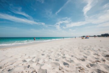 Fototapeta premium Out of focus scene showing a turquoise shore and pale sand