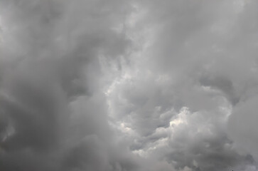 Dramatic dark storm clouds filling the sky, creating a moody and atmospheric weather scene with heavy overcast and natural cloud texture