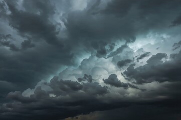Obraz premium Heavy storm clouds gathering in the sky. Approaching rain and ominous weather. Dark, expansive clouds in a natural setting. Timelapse footage.
