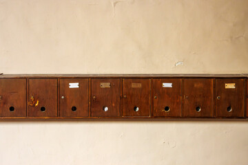 Row with wooden mail boxes in Urbino, Italy, Europe