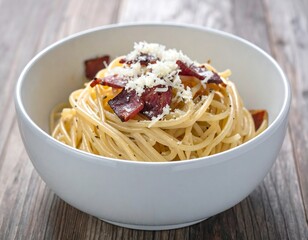 Delicious carbonara dish served in a white bowl on rustic wooden surface ready to be enjoyed
