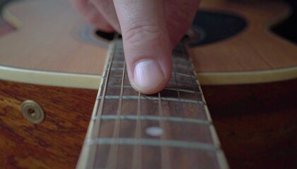 Fototapeta premium Close Up Of Fingers Sliding On Slide Guitar Fretboard