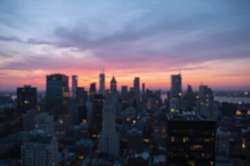 Fototapeta premium Sunrise over a misty urban horizon, featuring shadowy building outlines in gentle pastel tones for a peaceful cityscape scene.