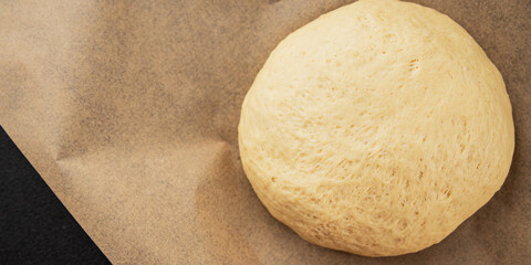 Dough raw cooking yeast, flour, water tasty snack fresh delicious gourmet food background on the table rustic food top view copy space