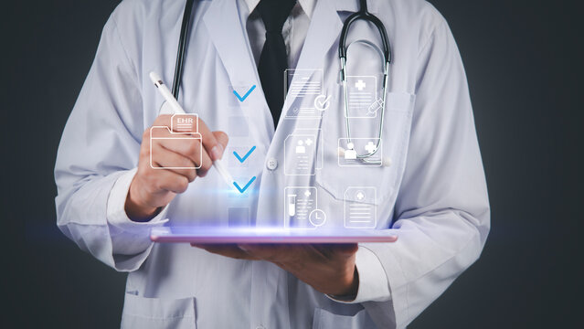 Modern healthcare technology concept showing doctor with digital tablet, holographic medical icons, EHR, telehealth, data security, and patient care innovation.