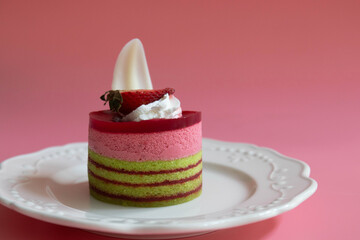 Dessert Concept , Strawberry cake on Pink Background