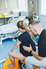 Young couple in the delivery room. Woman in labor and pain in despair and her husband supporting her. Man and his wife giving birth to a child. Delivery room for the birth of a child.