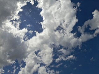 sky covered with partly cloudy cumulus clouds.