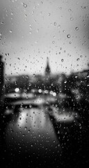 Obraz premium Rainy night city view through a window