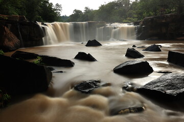 Tat Ton is a beautiful waterfall with water flowing all year round, On top of it, the water cascades down wide rock plateaus, with big trees lining up on both side of the stream Chaiyaphum ,THAILAND 