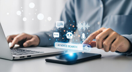 Person using laptop and smartphone with ai voice search interface overlayed