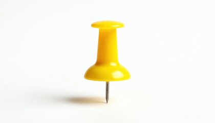 Bright yellow push pin isolated on clean white background. This common office supply, also known as a, features a plastic top and sharp metal needle for attaching notes or documents.