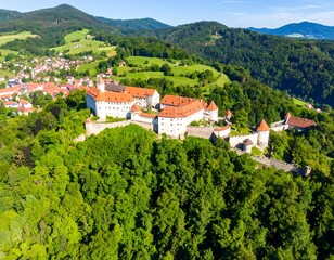 Obraz premium High-angle view of a castle nestled in a valley (1)