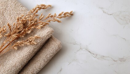 Beige towel and dried grasses on marble (3)