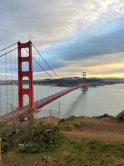 Golden Gate Bridge view with dramatic sky and evening light