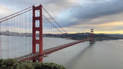 Golden Gate Bridge with San Francisco skyline in the background at sunset