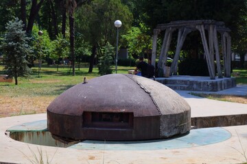 Old concrete bunker in Tirana, Albania. Historic military infrastructure in Lulishte Ismail Qemali public park.