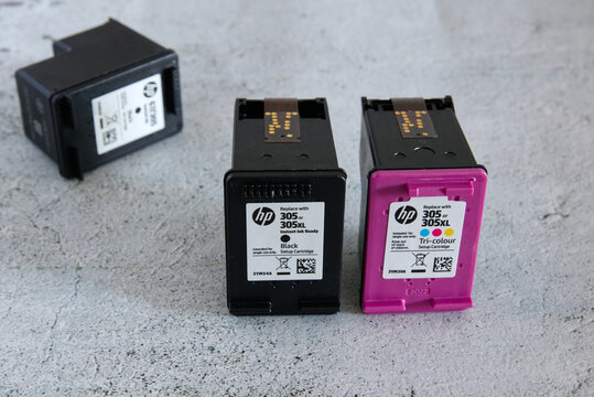 Empty HP printer cartridges on a light background