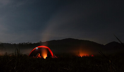 Camping Tent with Bonfire Under Starry Night Sky