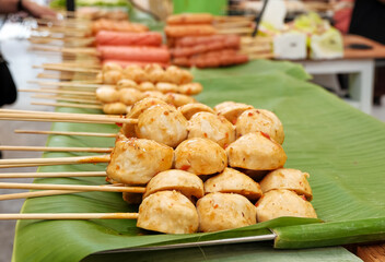 Grilled Meatball Skewers with Spicy Sauce on Banana Leaf Street Food Stall