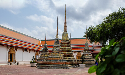 Colorful Buddhist Stupas and Traditional Temple Courtyard in Southeast Asia