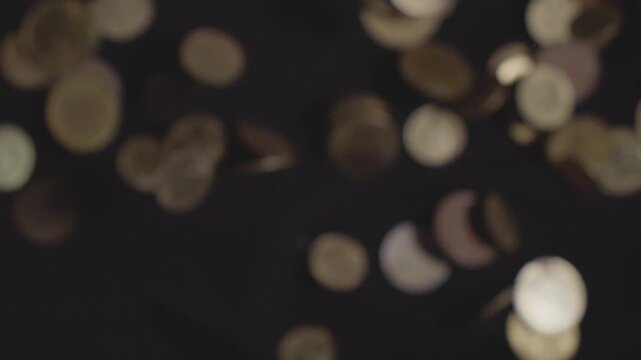 group of coins floating in the dark concept of finance and investment