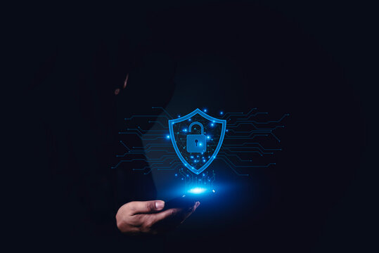 Cybersecurity visualization with hand holding smartphone and glowing shield lock, concept of mobile security, data privacy, protection, and safe digital connection. - Powered by Adobe