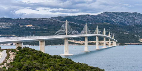 Brijesta, Croatia, 28 March 2025 - View on the Modern highway bridge (Pelješki most / Pelješac Bridge) connecting the peninsula of Croatia with the mainland of Croatia