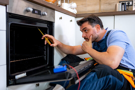 Repairing a kitchen oven with focus on troubleshooting issues at home