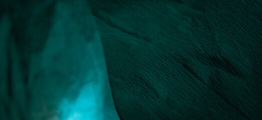 Horizontal trendy background for graphic design. Vintage teal paper surface with folds and shadows.