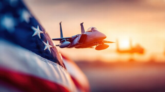 A toy jet airplane flies across the American flag at sunset, creating a patriotic scene.