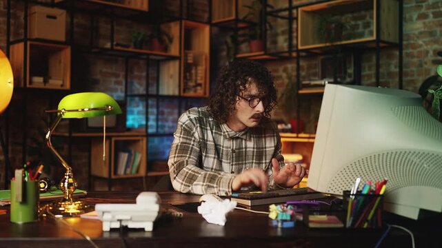Male programmer celebrating successful computer program launch in retro office